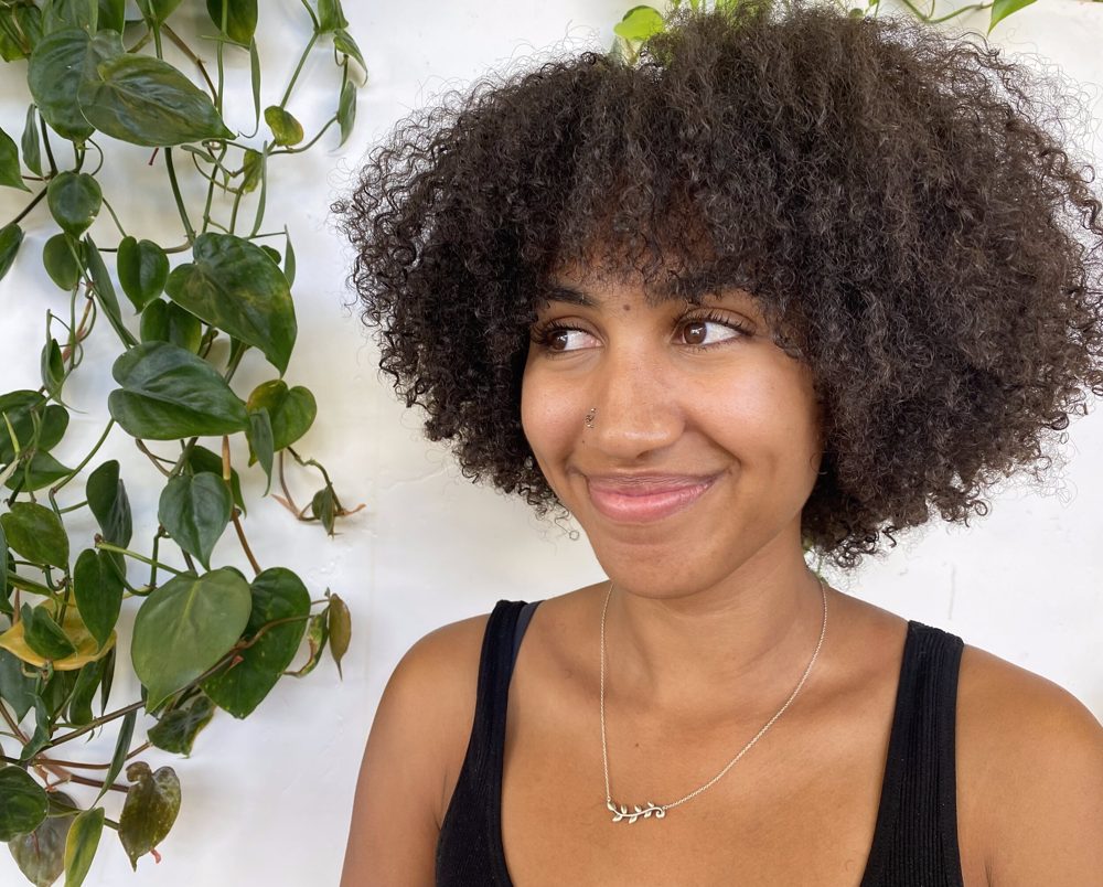 Curly hair with face-framing layers by Megan Clover