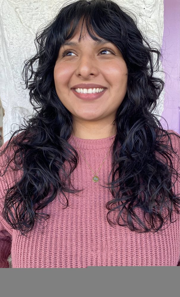Voluminous spiral curls styled for everyday wear