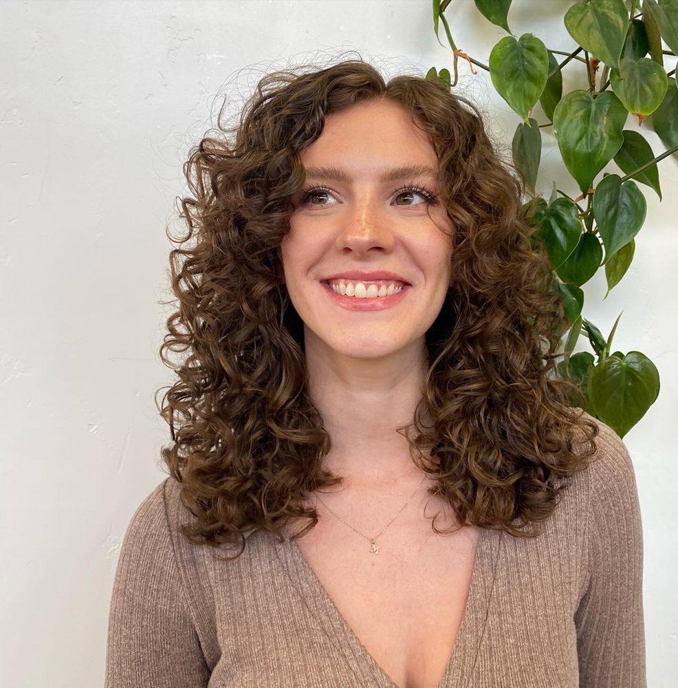Hand-painted highlights woven through wavy hair