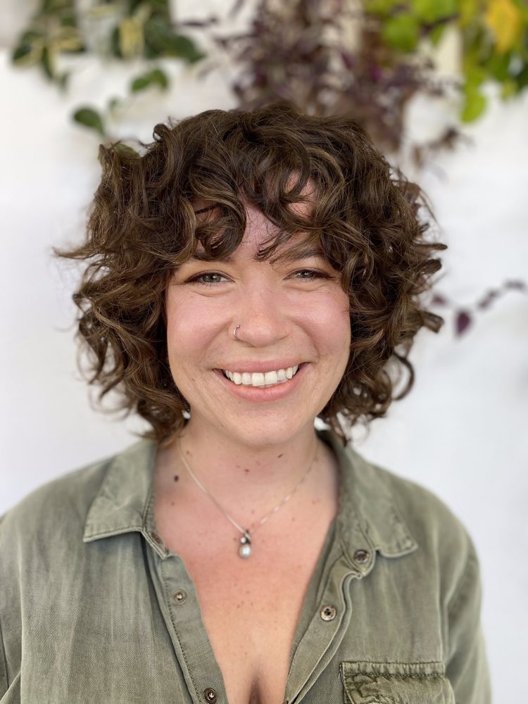 Short curly cut shaped for a defined curl pattern